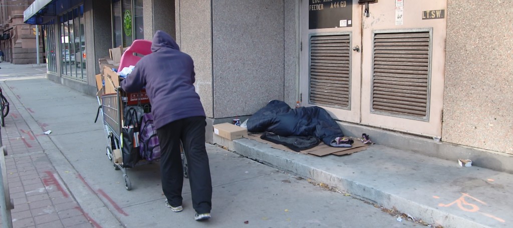 Homeless man in Toronto checks on another man who's sleeping rough