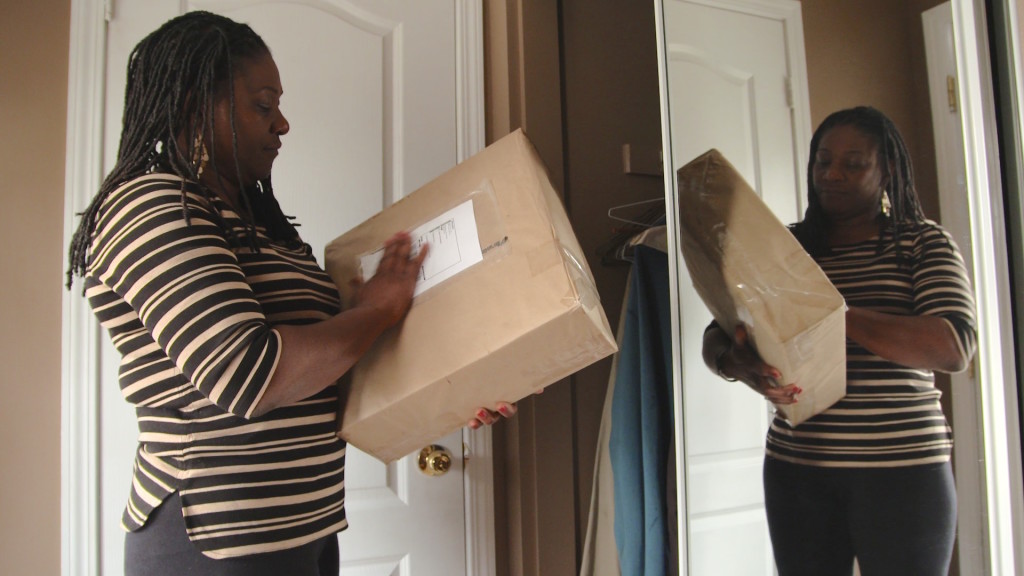 Jackie Christopher with the box that was returned to her after the inquest into her son's death in a police shooting. It almost certainly contains the clothes he died in