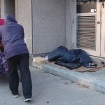 Homeless man in Toronto checks on another man who’s sleeping rough