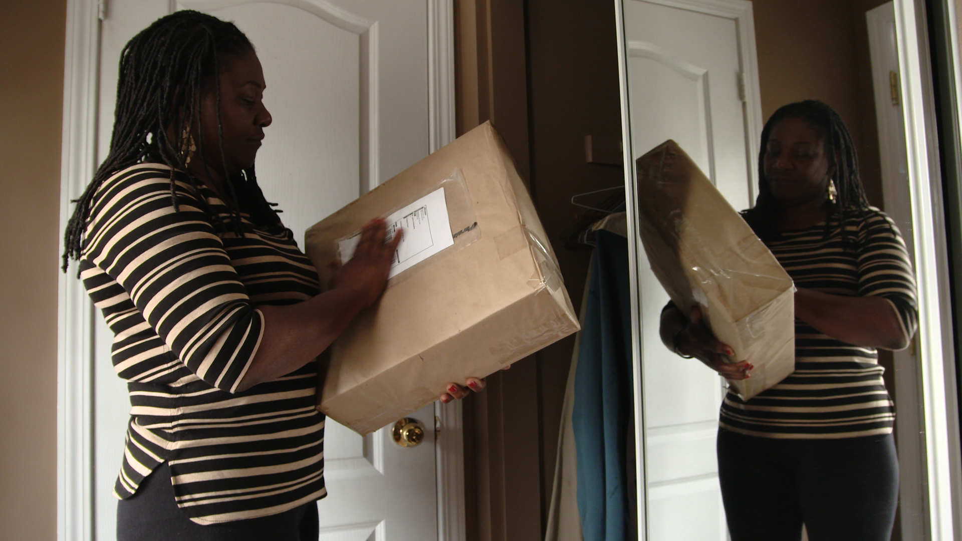 Jackie Christopher with the box that was returned to her after the inquest into her son’s death in a police shooting. It almost certainly contains the clothes he died in